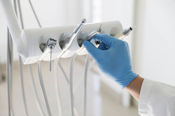 Professional Tooth Extraction technician working in Brookside Village, TX